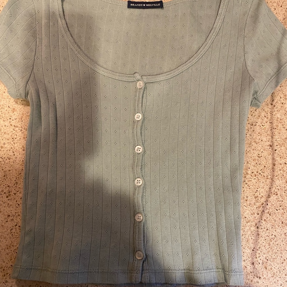 Brandy Melville top in light sage green.